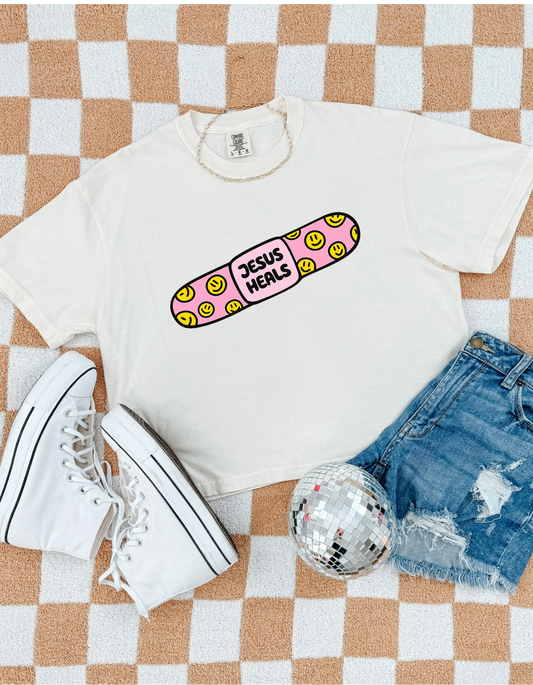 Jesus Heals Smiley Bandage Graphic Tee